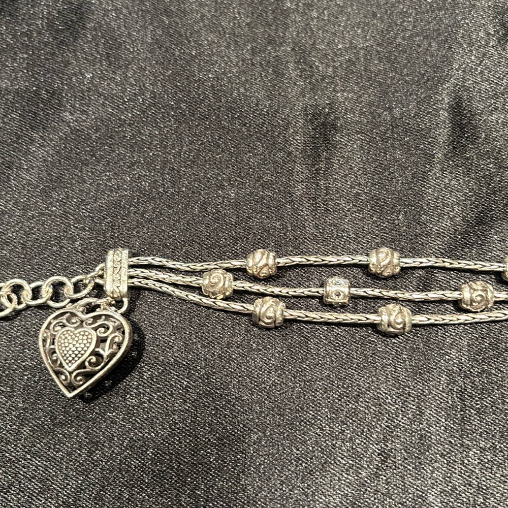 Brighton three strand Silvertone bracelet with heart.